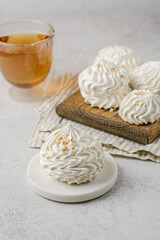 meringue on a wood on white background