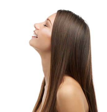 Feeling Free. A Beautiful Young Woman With Luxurious Hair Isolated On A White Background.