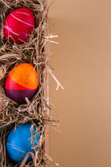 Easter eggs. Festive decoration. Easter. Celebration. Bright holiday. Eggs on a beige background. Multi-colored eggs on a beige background.