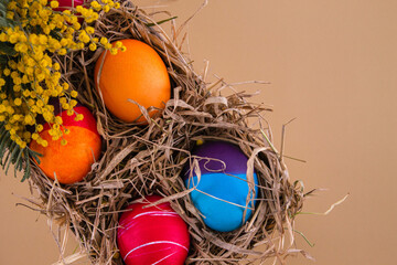 Fototapeta na wymiar Easter eggs. Festive decoration. Easter. Celebration. Bright holiday. Eggs on a beige background. Multi-colored eggs on a beige background.