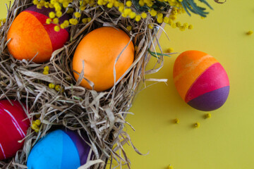 Easter eggs. Festive decoration. Easter. Celebration. Bright holiday. Eggs on a green background. Multi-colored eggs on a green background.