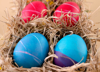 Fototapeta na wymiar Easter eggs. Festive decoration. Easter. Celebration. Bright holiday. Eggs on a beige background. Multi-colored eggs on a beige background.