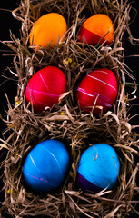 Easter eggs. Festive decoration. Easter. Celebration. Bright holiday. Eggs on a black background. Multi-colored eggs on a black background.