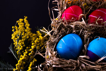 Easter eggs. Festive decoration. Easter. Celebration. Bright holiday. Eggs on a black background. Multi-colored eggs on a black background.