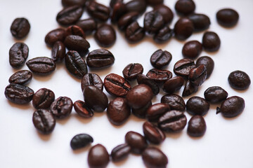 roasted coffee beans close-up on a white background