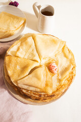 Yeast flour pancakes on a light background