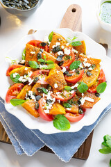 Pumpkin salad with tomatoes and cheese