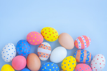 Fototapeta na wymiar Colorful easter eggs on blue background