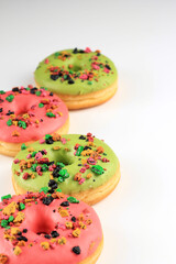Assorted Pink and Green Doughnut with Colorful Sprinkle Isolated on White Background, Copy Space for Text