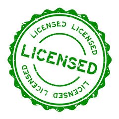 Grunge green licensed word round rubber seal stamp on white background