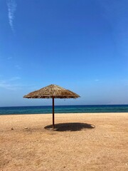 View of the beach and umbrella in Jordan, Red Sea