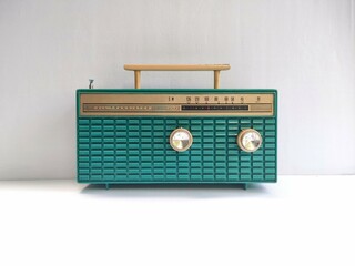 old green radio on white wallpaper background