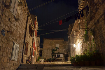 Fototapeta na wymiar Ulica od Šorte, Dubrovnik, Croatia, at night: a quiet backstreet courtyard