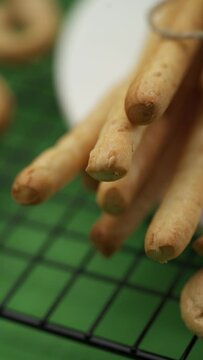 Close-up: Italian pastries on a lattice pattern, Italian bread sticks