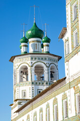 The bell tower of the Nikolo-Vyazhishchsky Convent on a sunny March morning. Vyazhishchi, Novgorod region. Russia