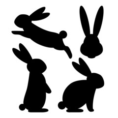 Set of silhouettes of rabbits sitting, standing and jumping.