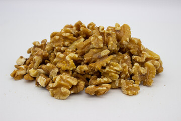 Peeled walnuts on white background