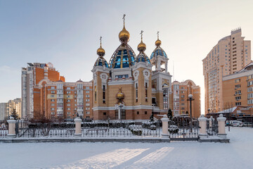Winter urban landscape with an Orthodox church. Obolon, Kyiv