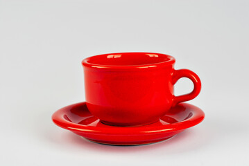 Ceramic red coffee mug close up. Coffee isolated on a white background. Copy space and free space for text near the drink.