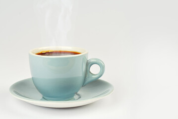 Ceramic blue coffee mug close up. Coffee isolated on a white background. Copy space and free space for text near the drink.