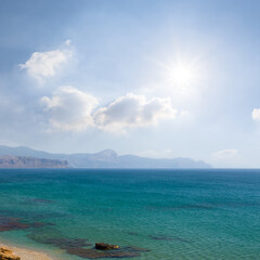 emerald sea bay with rocky coast at the sunny day