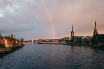 Beautiful cityscape of morning city and river with rainbow. River Ness, Inverness, Scotland