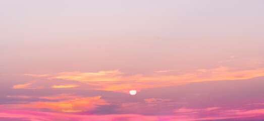 Naklejka na ściany i meble sunset orange evening sky with fluffy clouds background