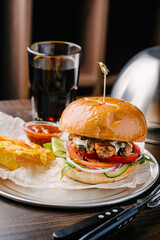 Juicy burger with mussels, sauce and cola
