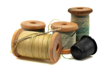 Vintage retro spool of thread on a white background. Needle with thread isolate