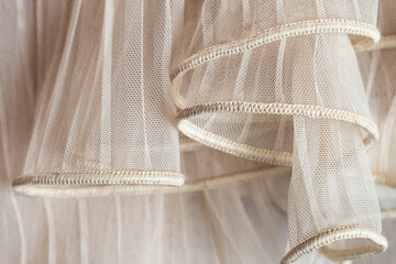 texture of falded ivory tulle fabric background