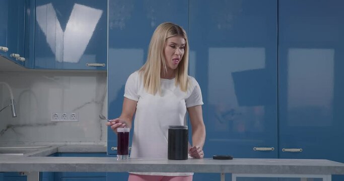 Athletic girl cooked baa and going to drink it