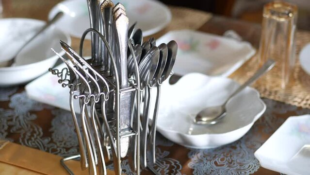 cutlery on plate on wooden background 