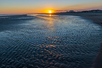 Sunset Over The Tidal Flats of Folly Beach, Folly Island, South Carolina, USA