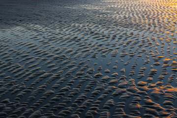 Sunset Over The Tidal Flats of Folly Beach, Folly Island, South Carolina, USA