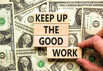 Keep up the good work symbol. Concept words Keep up the good work on wooden blocks. Businessman...