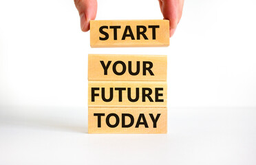 Start your future today symbol. Concept words Start your future today on wooden blocks. Businessman hand. Beautiful white table white background. Start your future today business concept. Copy space.