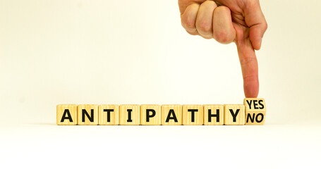 Antipathy yes or no symbol. Psychologist turns a wooden cube and change words Antipathy no to...