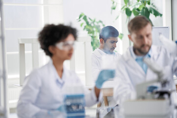 scientists examining control samples in the laboratory .