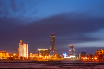 Fototapeta premium Early Spring night on the banks of the pond in the city center