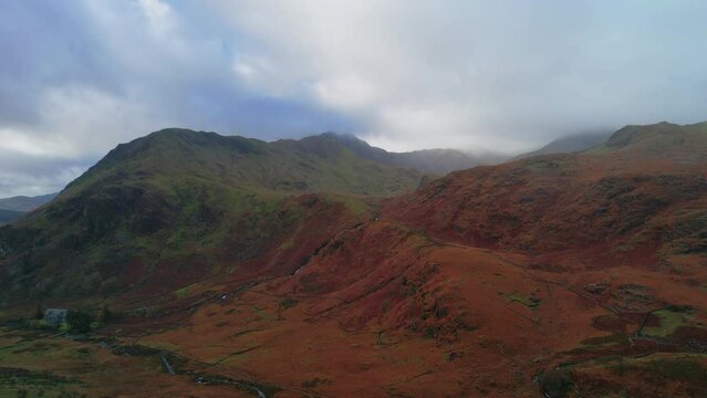 Pen-y-Pass mountain on coudy day, Snowdonia, Gwynedd in north-west Wales, Uk. Aerial rising