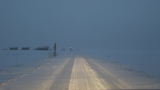 FPV drive on deserted winter road in extreme weather snow blizzard