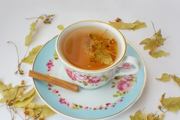 Linden tea in cup on white background.