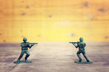 image of toy soldiers over wooden table