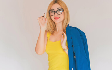 Business style for ladies, women in blue jacket and yellow top, fashionable concept