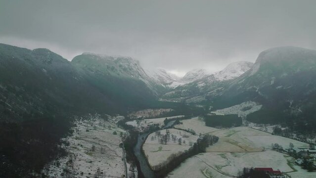 Clouds Over Nes Viglesdalen Snowy Mountain Valley In Norway, Aerial