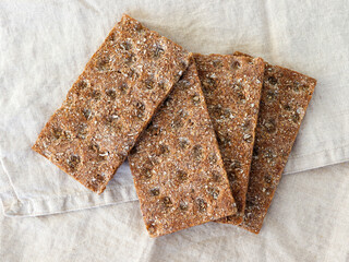 Swedish traditional rye crispbreads on textile background