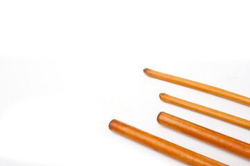 Four bamboo sticks to massage the face and other parts of the body.