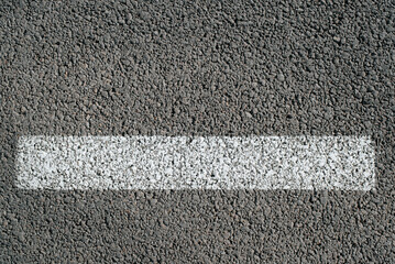 Single white line on asphalt top view. Road markings, one stripe on roadside outdoors, close-up
