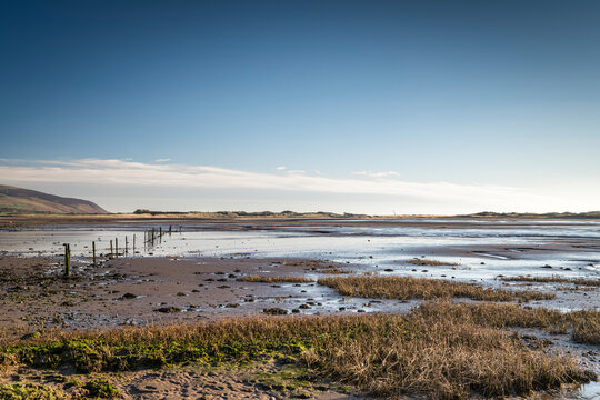 A peaceful, sunny, winter full frame HDR landscape image of Saltcoats bay at low tide near Ravenglass, Cumbria, England