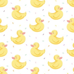 Seamless vector pattern with cute hand drawn rubber duckling and confetti. Kawaii animal background for kids room decor, nursery art, card, gift, fabric, textile, wrapping paper, wallpaper, packaging.